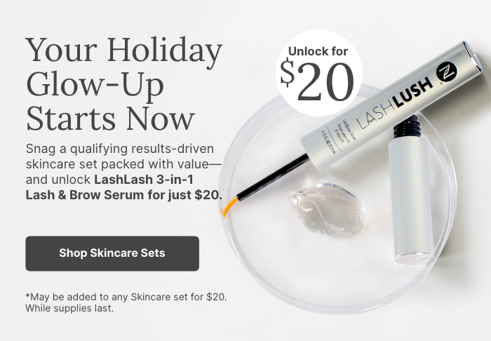 Holiday skincare promotion featuring LashLash 3-in-1 Lash & Brow Serum on a clear dish with gel, highlighting limited-time $20 offer when purchased with qualifying skincare sets.